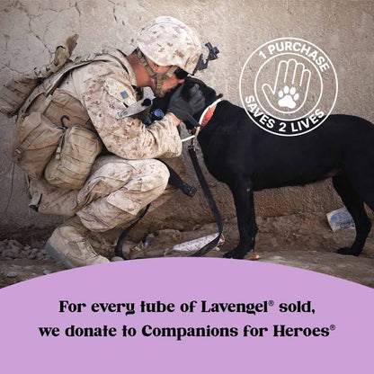 Top: Soldier in desert camouflage and full military apparel kneels and kisses the forehead of black dog; stamp superimposed on top right of image reading '1 Purchase Saves Two Lives' ; bottom: purple arc contains text: For every tube of Lavengel sold, we donate to Companions for Heroes